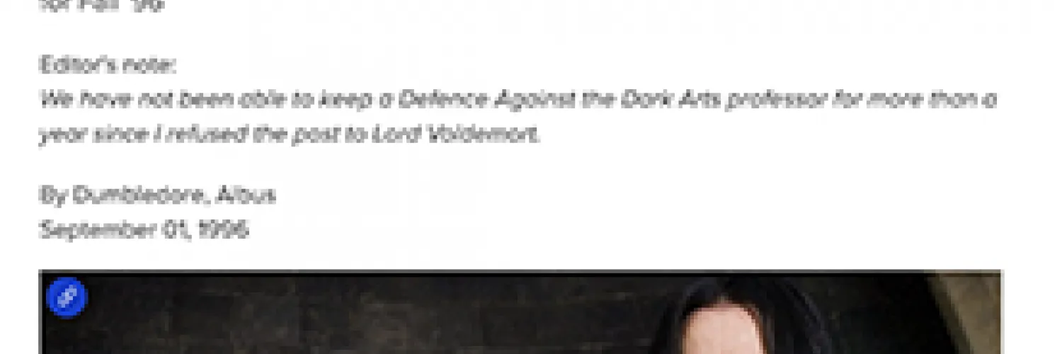 A man stands wearing a black top while standing in front of a wall of bottled spirits. 